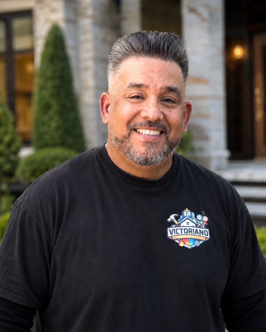 Danny from Victoriano Construction smiling in a professional outdoor portrait